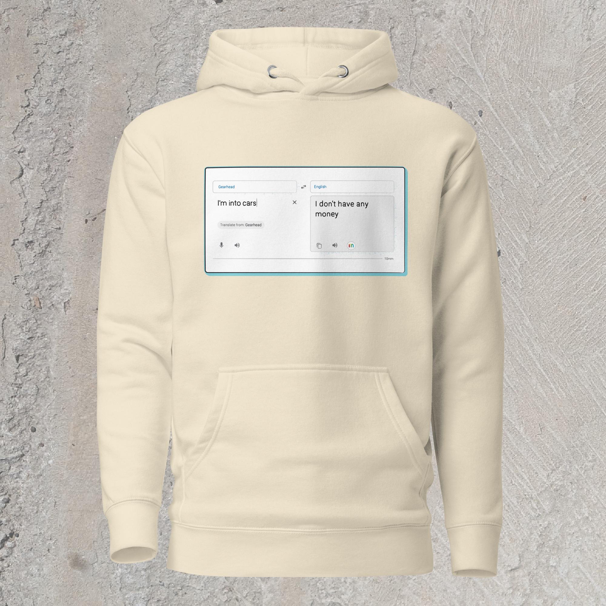 10mm funny car graphic cream white hoodie sweatshirt with online translator reading the phrase “I’m into cars” in gearhead language and translating to English as “I don’t have any money”