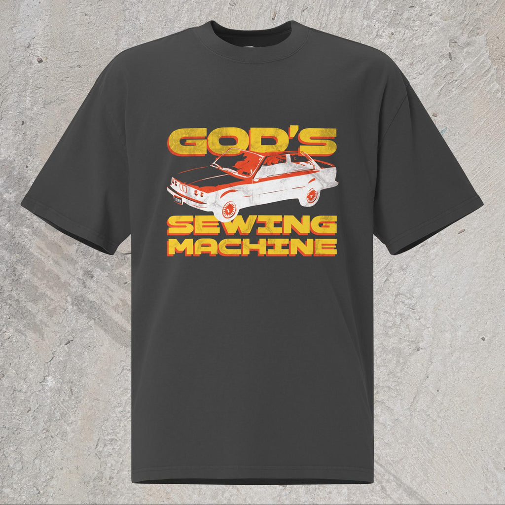 10mm funny car graphic black oversized T-shirt displaying BMW E30 with yellow text that reads “GOD’S SEWING MACHINE”
