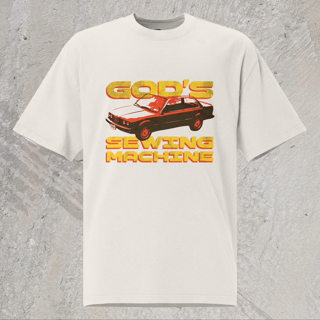 10mm funny car graphic white oversized T-shirt displaying BMW E30 with yellow text that reads “GOD’S SEWING MACHINE”