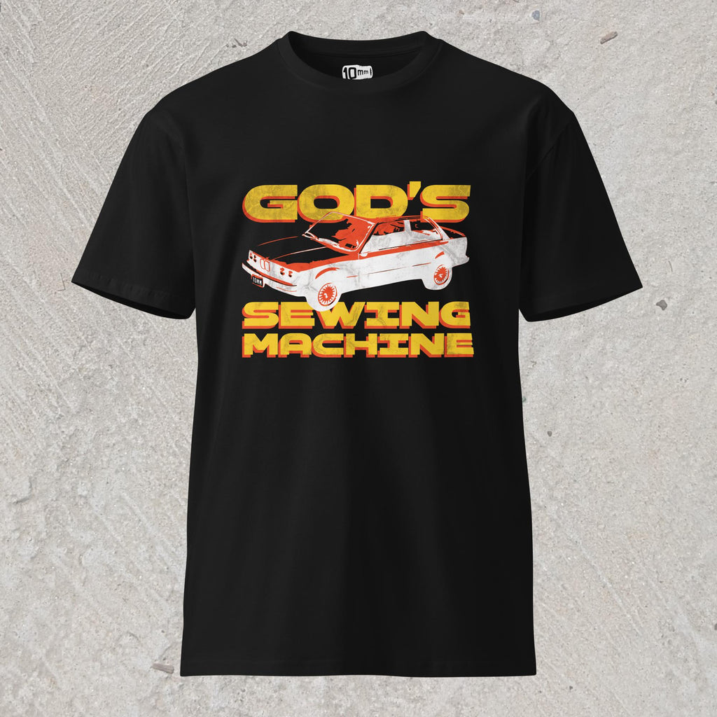 10mm funny car graphic black T-shirt displaying BMW E30 with yellow text that reads “GOD’S SEWING MACHINE”