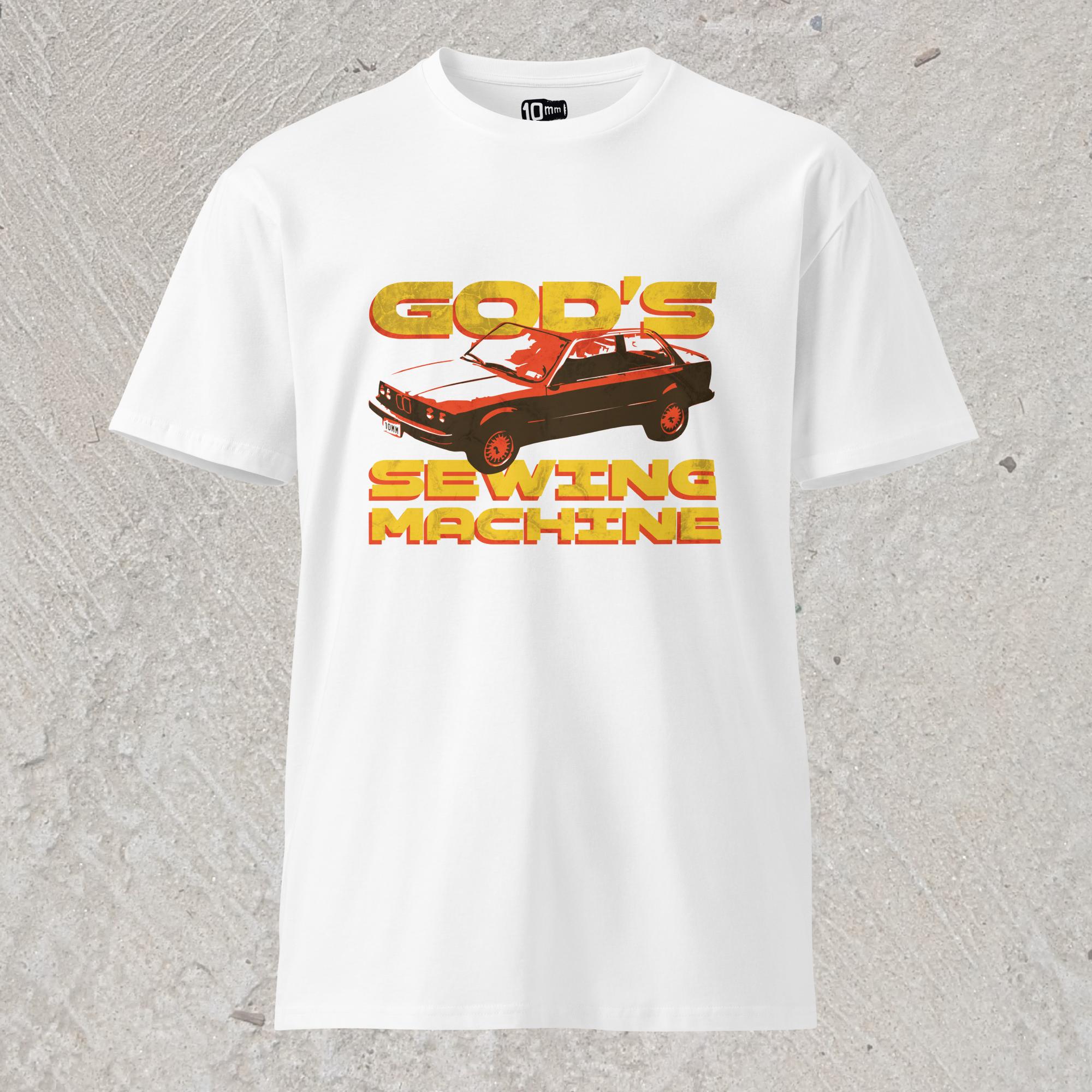 10mm funny car graphic white T-shirt displaying BMW E30 with yellow text that reads “GOD’S SEWING MACHINE”