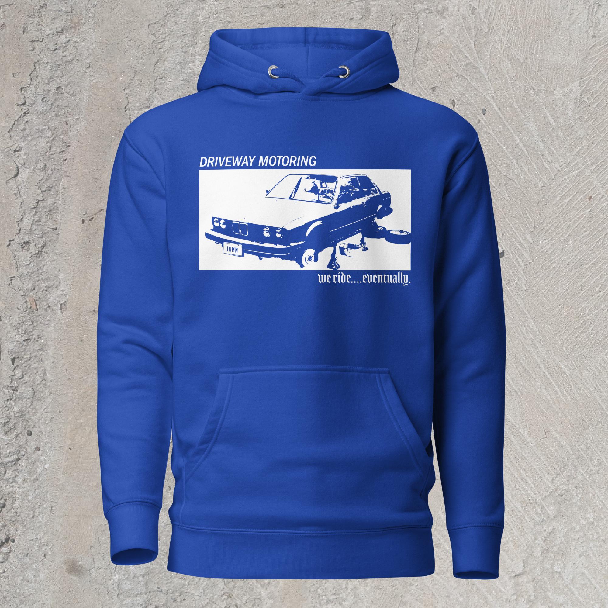 10mm funny graphic blue hoodie sweatshirt with BMW car on jack stands with text "Driveway motoring. We ride...eventually"