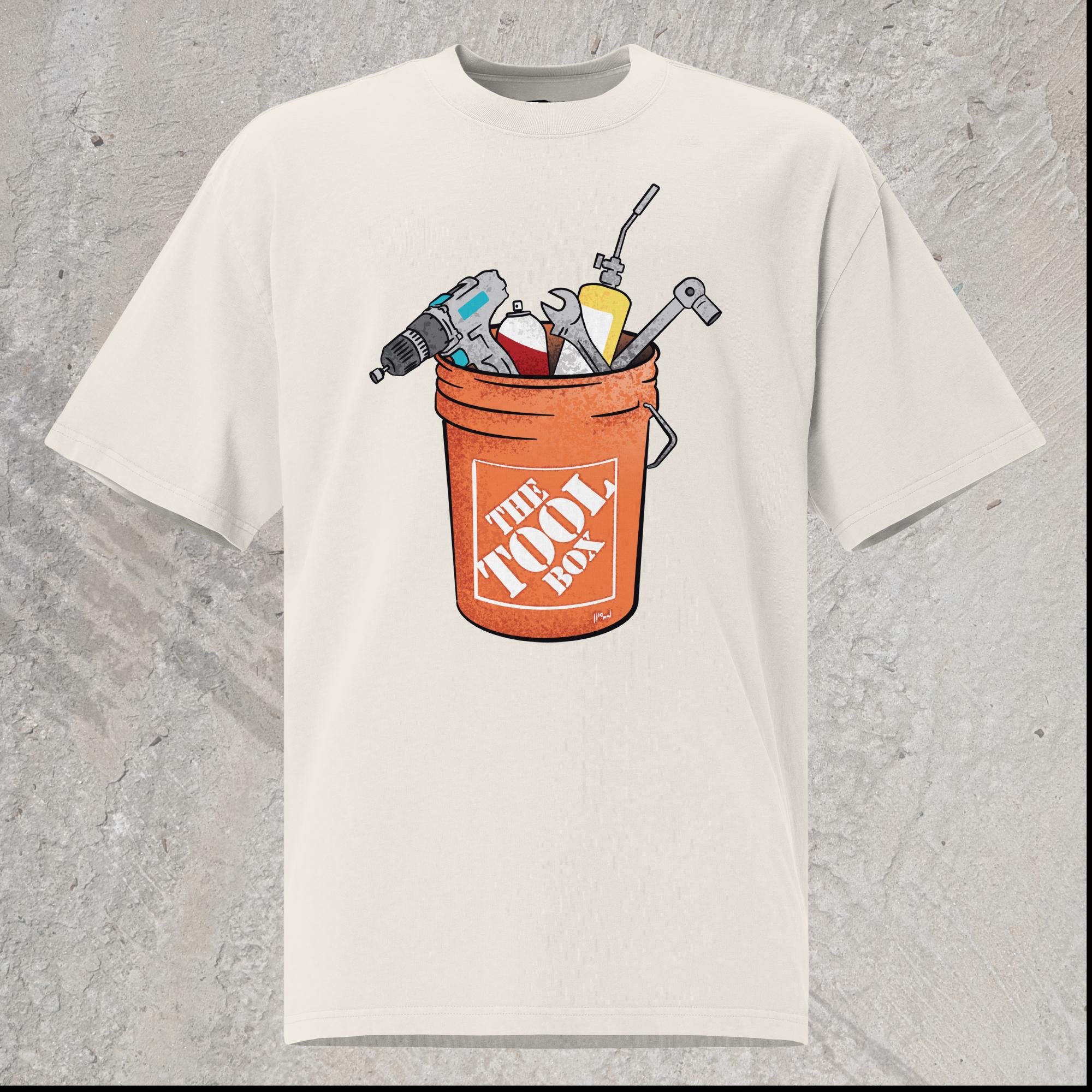 10mm funny graphic white oversized T-shirt with orange bucket full of tools for working on cars. Text on bucket reads “The Tool Box”
