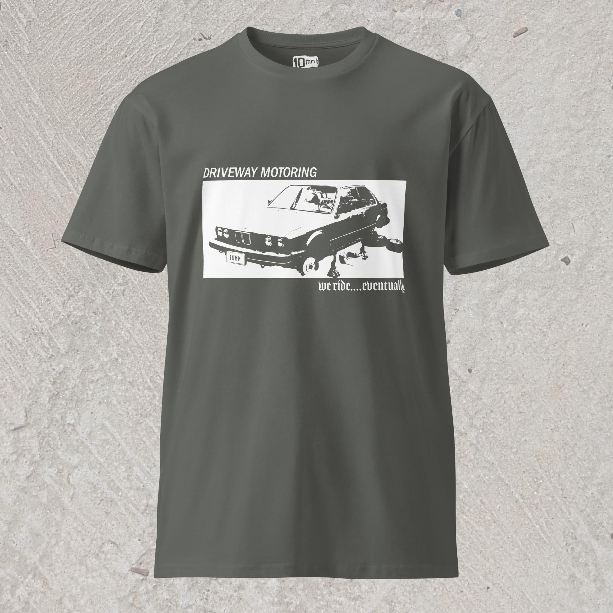 10mm funny graphic gray T-shirt with BMW car on jack stands with text "Driveway motoring. We ride...eventually"