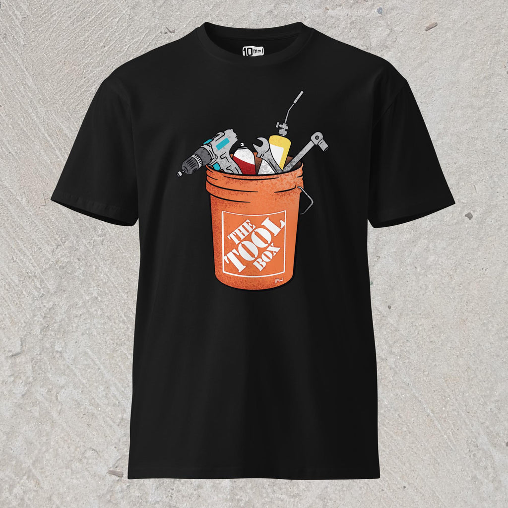 10mm funny graphic black T-shirt with orange bucket full of tools for working on cars. Text on bucket reads “The Tool Box”