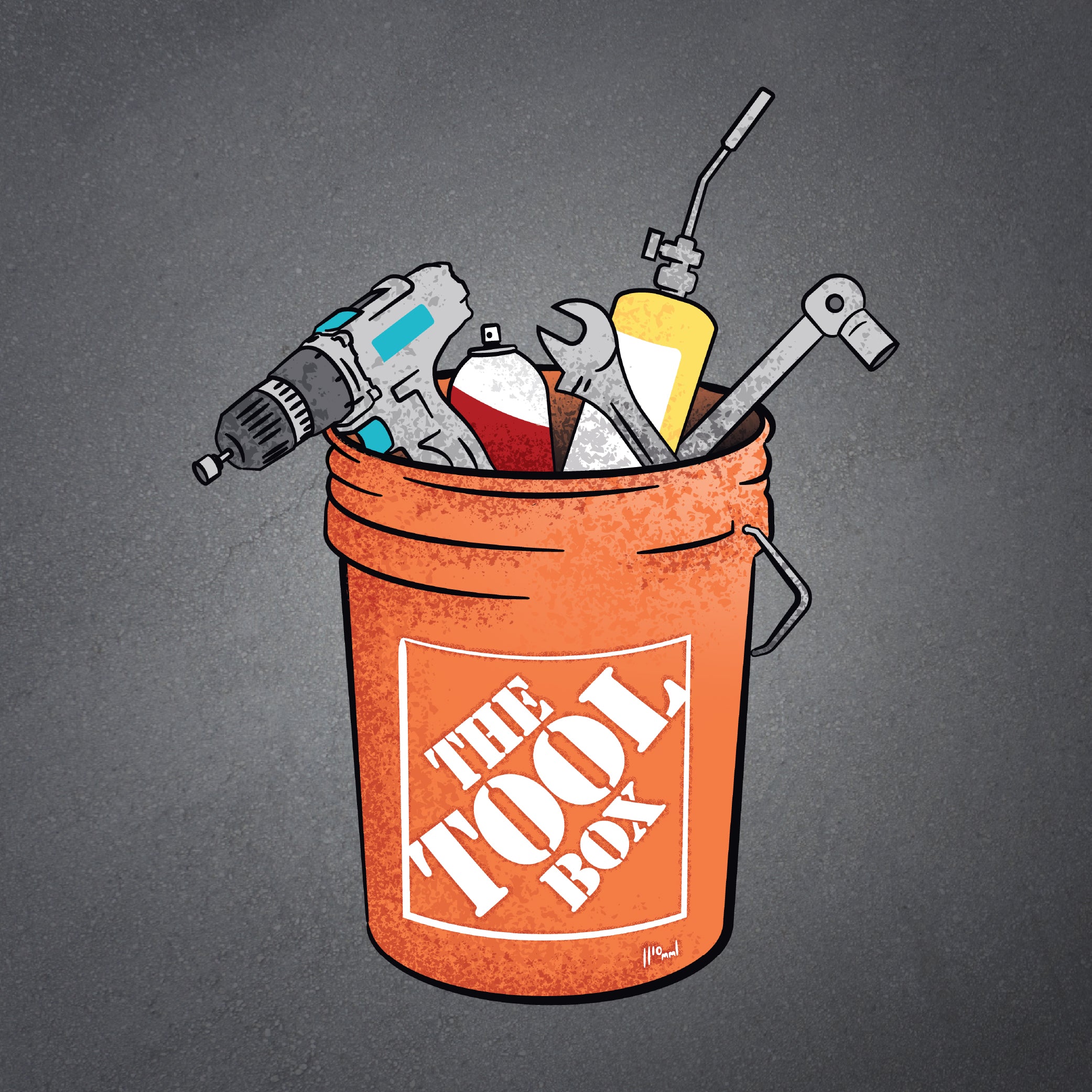 Orange bucket labeled 'The Toolbox' filled with tools on a dark background