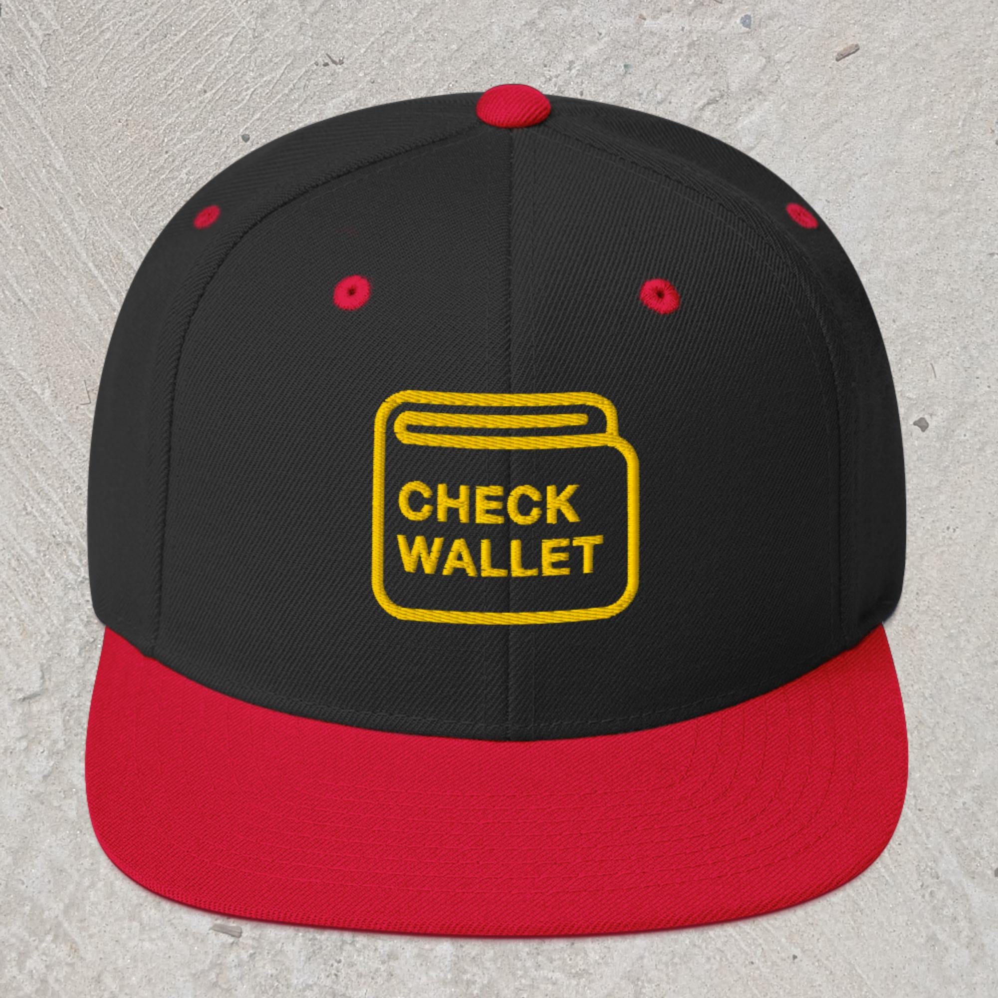 Black snapback hat with red rim and embroidered wallet icon that reads "Check Wallet"