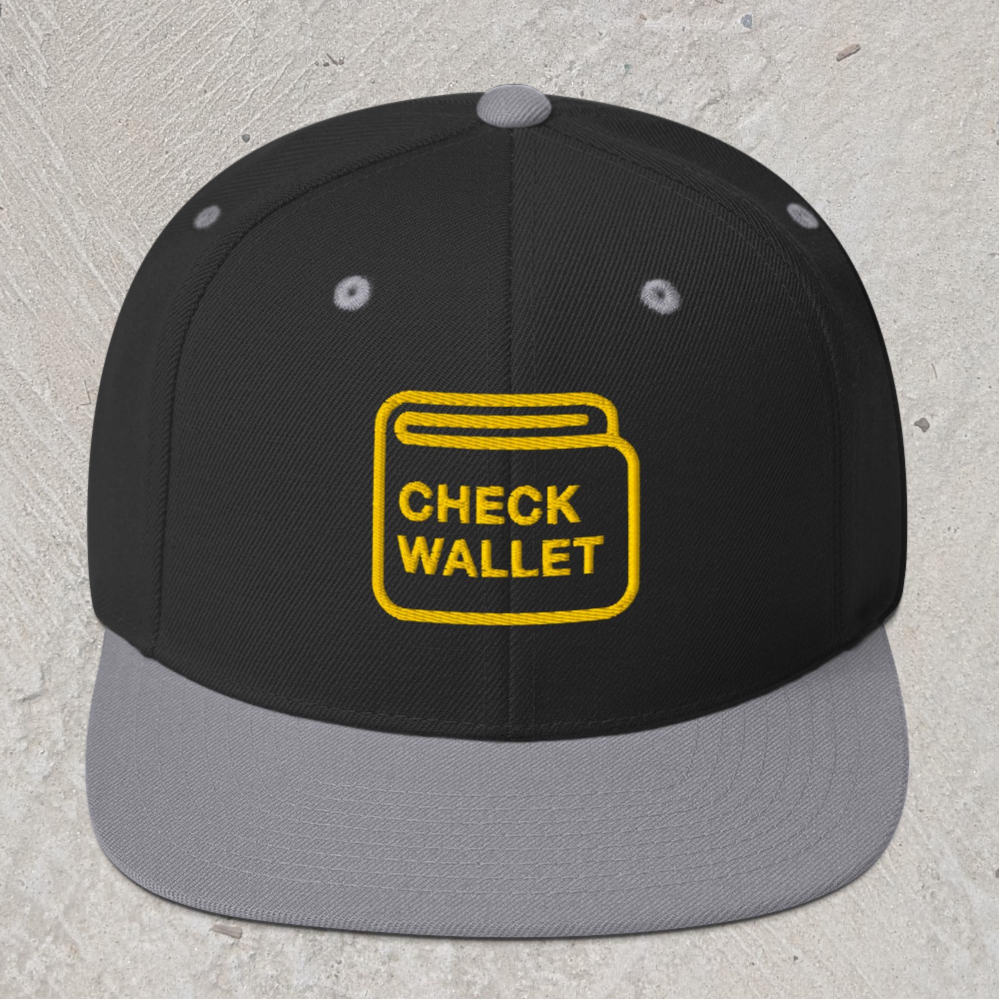 Black snapback hat with gray rim and embroidered wallet icon that reads "Check Wallet"